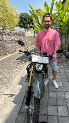 A customer with a Honda CRF 150L in a narrow gang